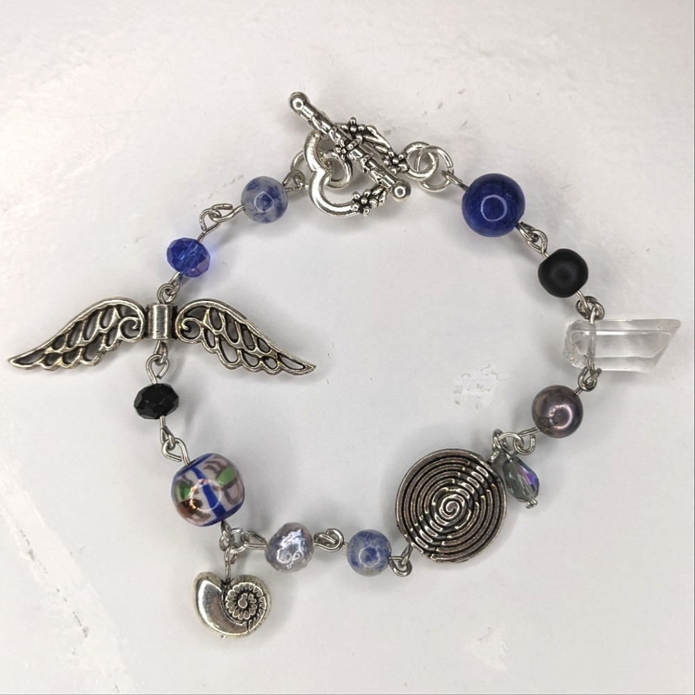 Bracelet with blue bead metal beads and a toggle clasp. Handmade by me.